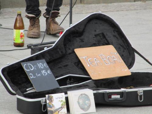 Street musicians. Yeah, I bought a couple CDs. They only had solo CDs for each of them. Trying to earn money to make their new group CD.